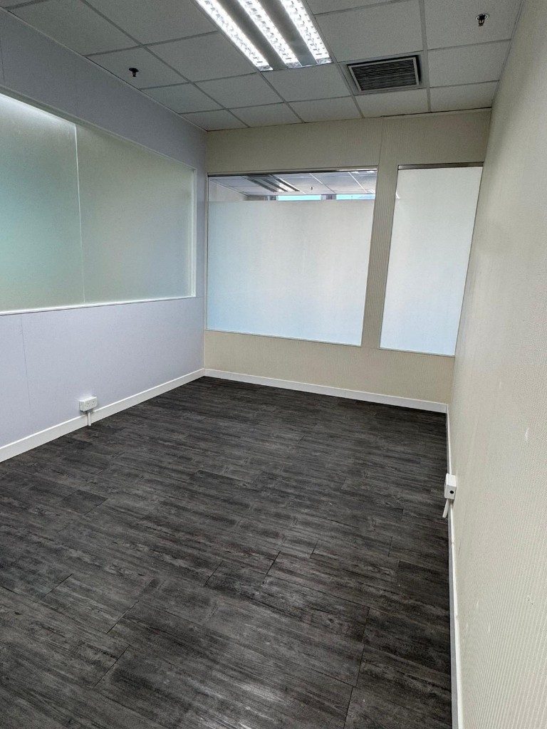 Room 6003, empty, with frosted glass along the wall